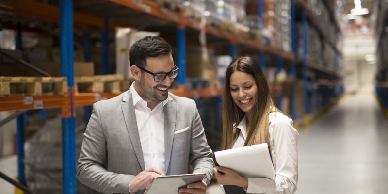 managers visiting storage center and discussing about distribution and goals for next year.